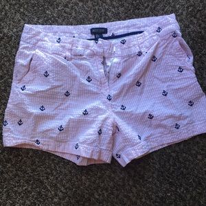 Shorts. Pink and white strips with blue anchors.